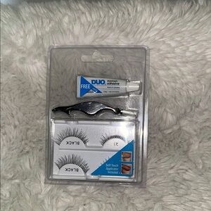 Eye lashes new with glue never opened new with box just stored away and tweezers